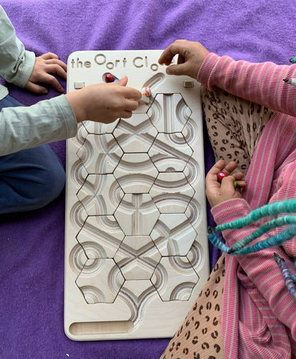 The Oort Cloud: A Marble Run Puzzle Game